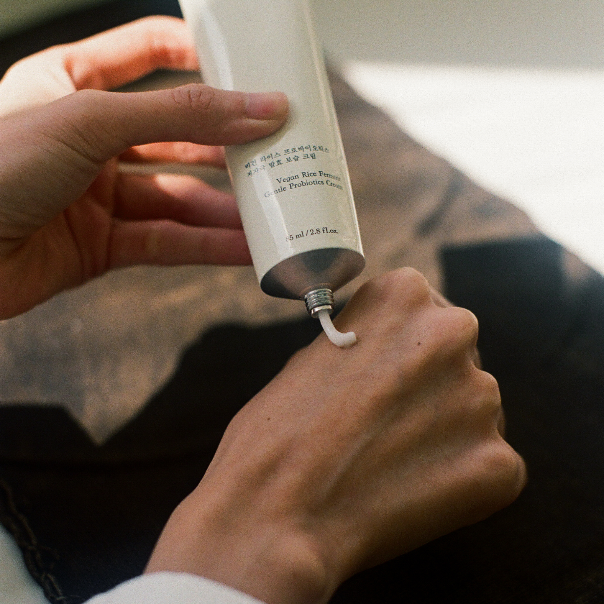 Hyeja vegan rice ferment probiotic moisturizer in minimalist white tube, showcasing clean beauty product with natural skincare ingredients