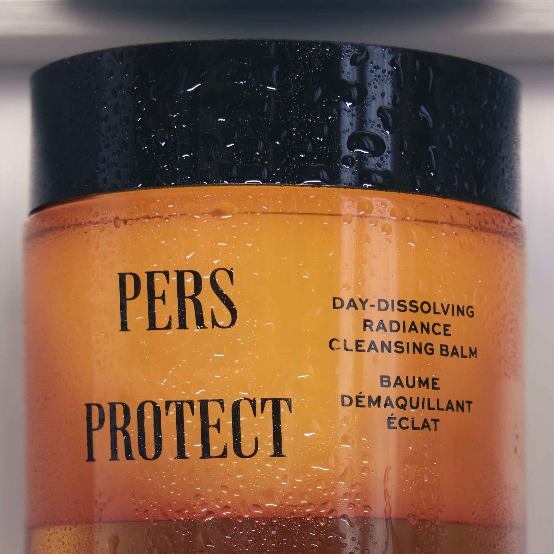 PERS Cleansing Balm being applied in a step-by-step skincare routine video, demonstrating proper cleansing technique and product usage