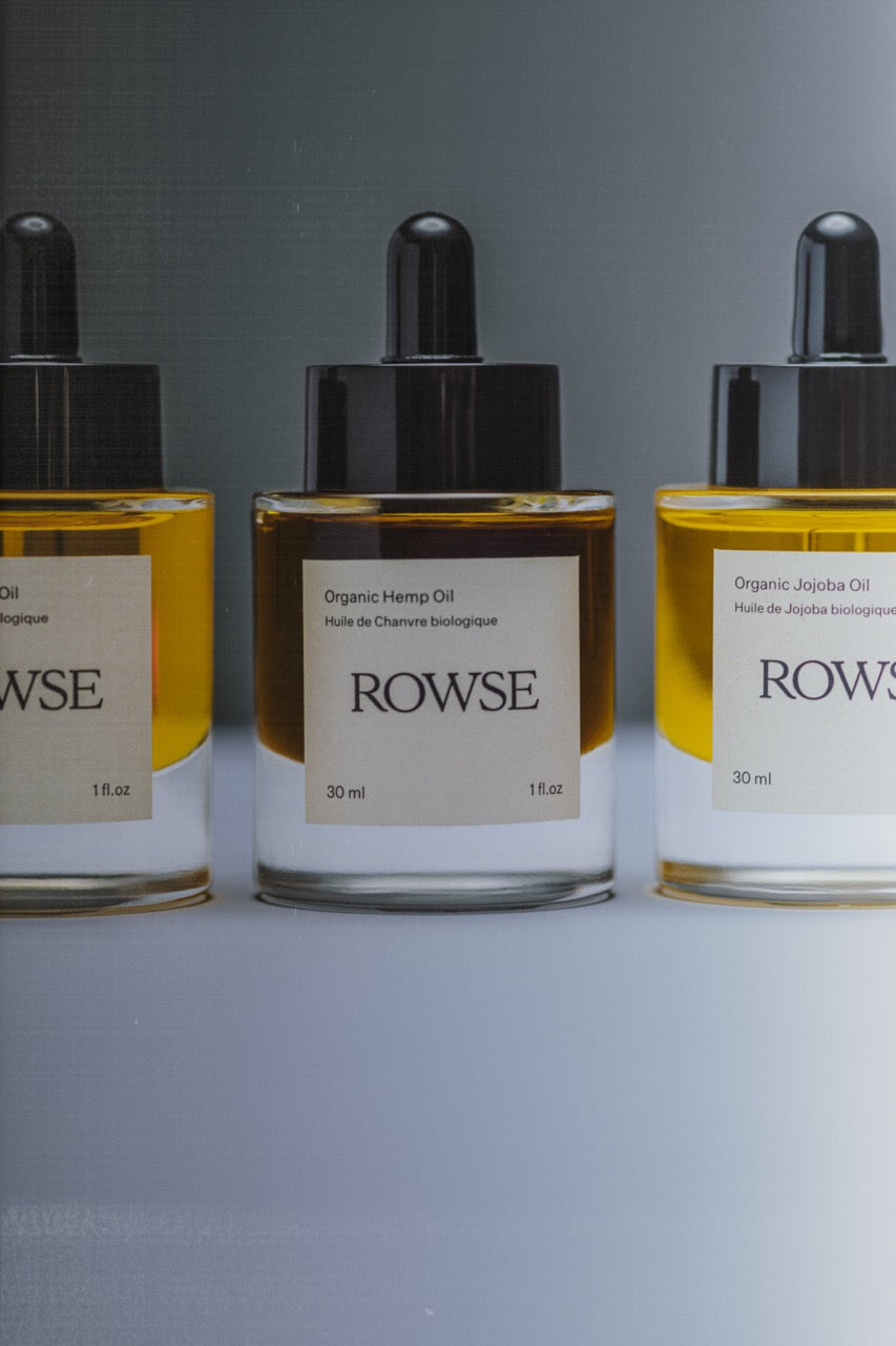 ROWSE organic cold-pressed face oils collection featuring Organic Hemp Oil and Organic Jojoba Oil in minimalist amber glass bottles with black dropper caps