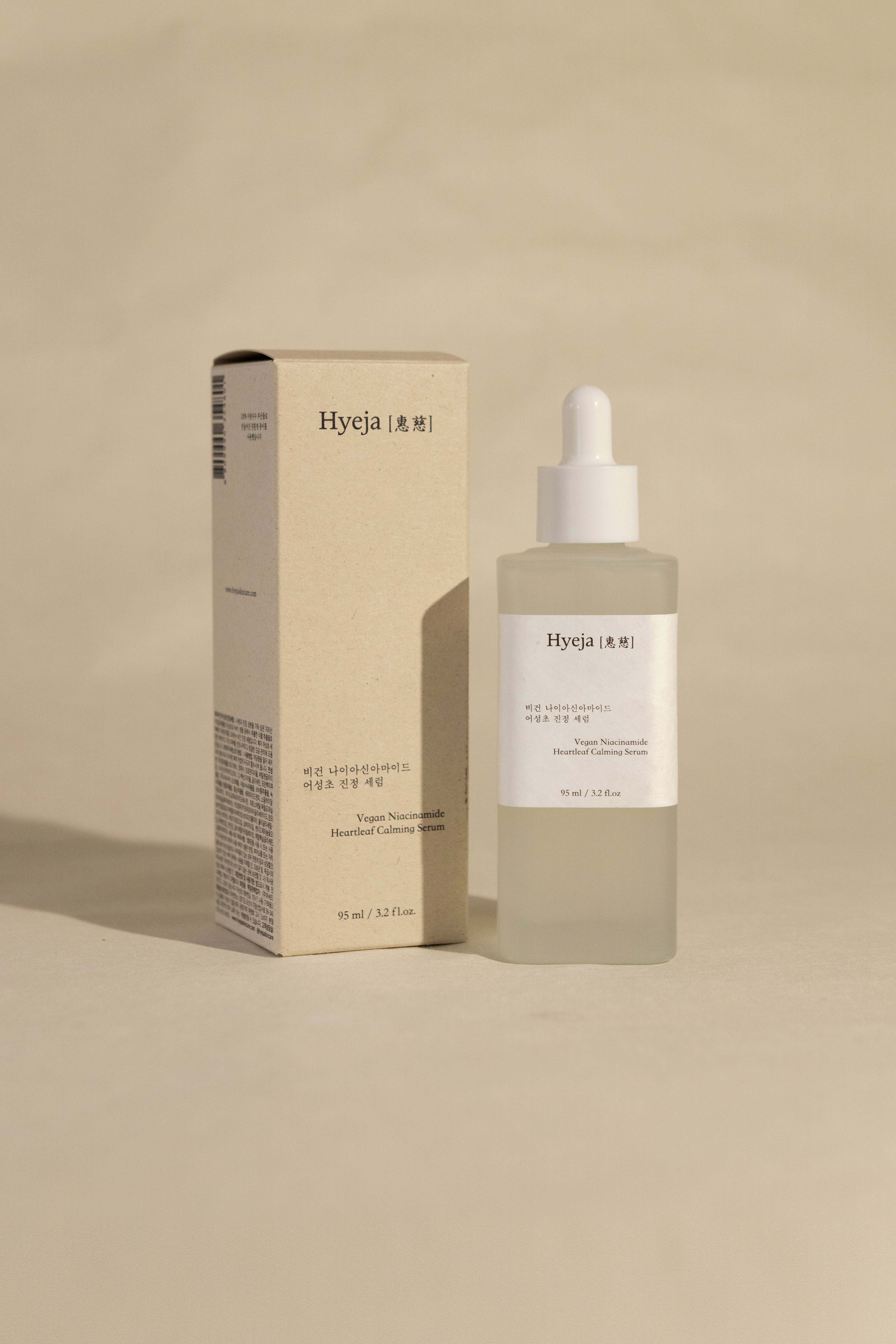Hyeja Vegan Niacinamide Heartleaf Calming Serum in minimalist packaging, showcasing Korean skincare's clean, clinical aesthetic
