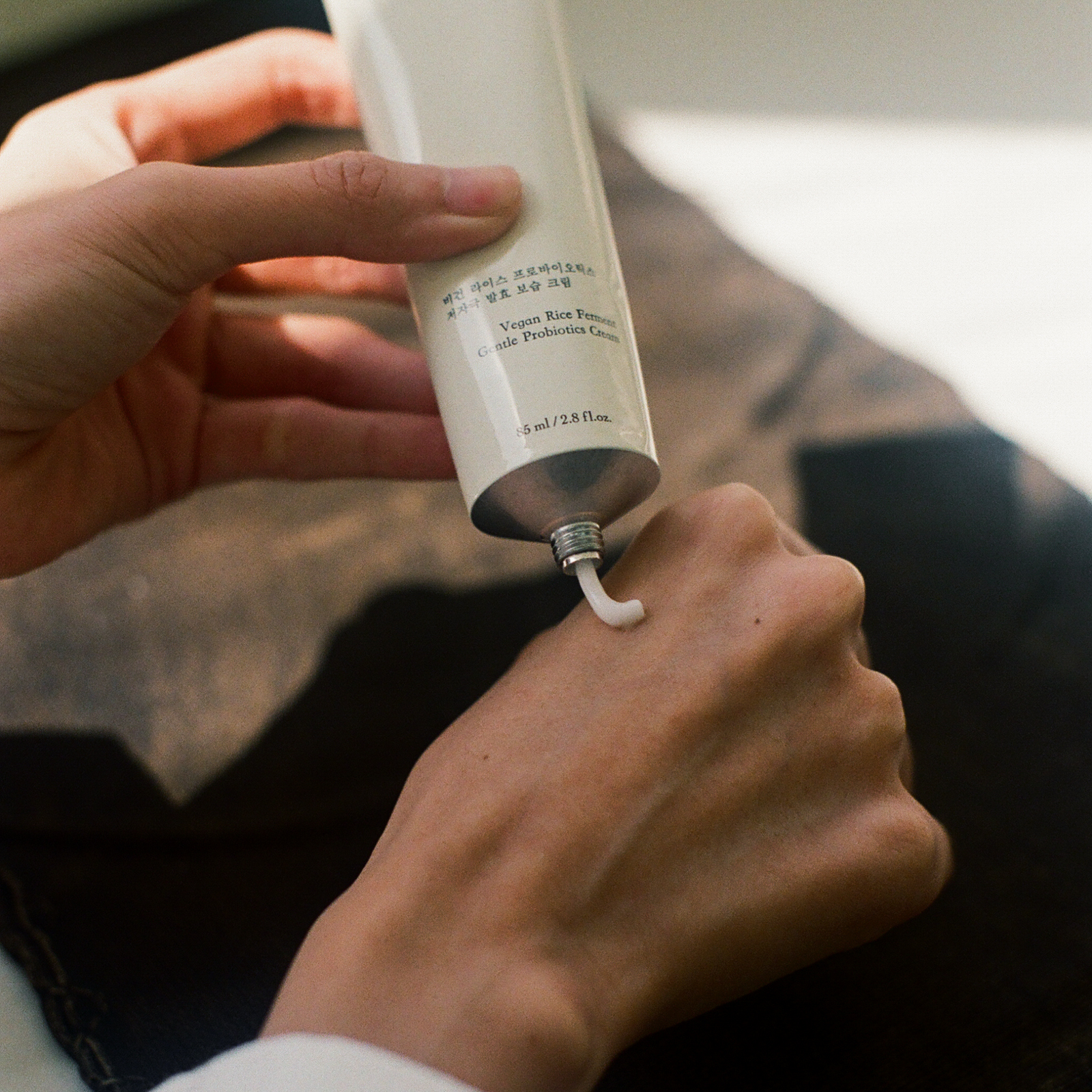Hyeja vegan rice ferment probiotic moisturizer in minimalist white tube, showcasing clean beauty product with natural skincare ingredients

