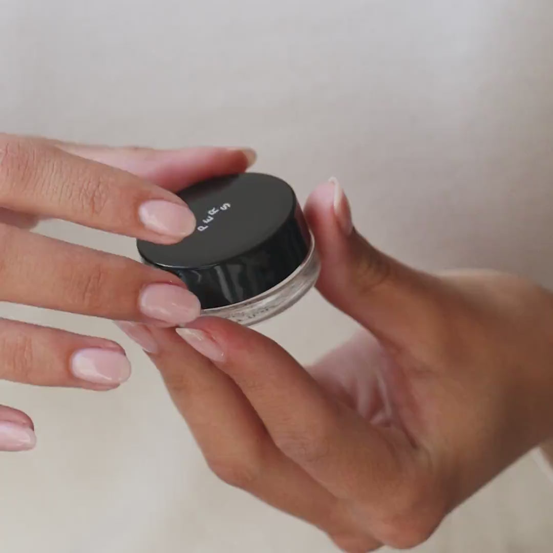 PERS Lips and Cheeks Glow Balm being applied in a lifestyle video, demonstrating multi-use beauty product technique for natural, dewy look
