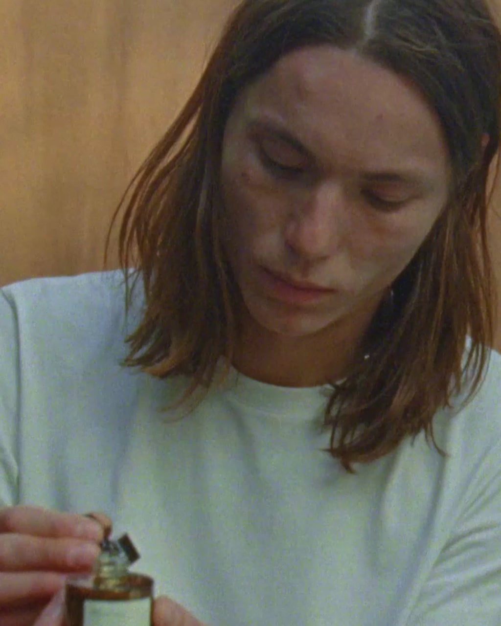 ROWSE Repair Night Serum being carefully applied, demonstrating precise nighttime skincare routine and serum absorption technique
