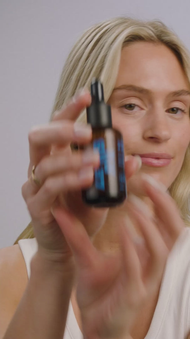 Le Rub Sunset Serum application video showcasing dropper technique, amber serum texture, and gentle facial massage in golden hour lighting