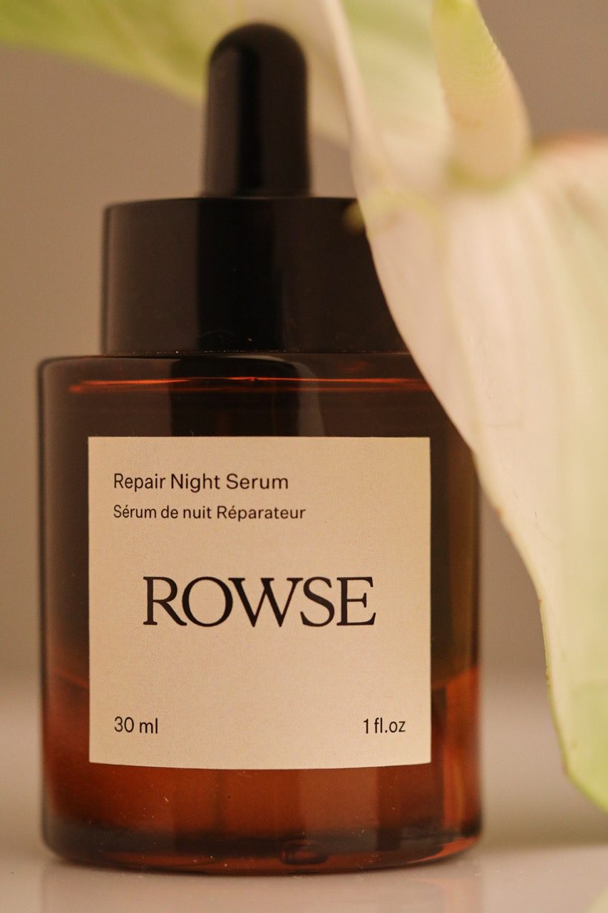 ROWSE Repair Night Serum in amber glass bottle with black dropper, showcasing bilingual packaging and minimalist design
