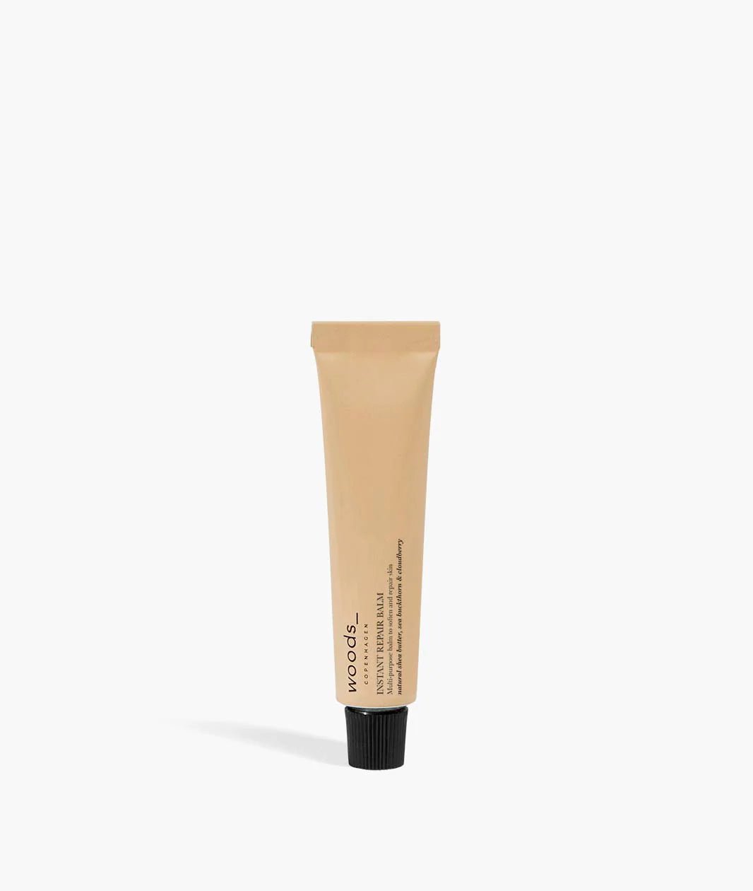 Woods Copenhagen Instant Repair Balm showcased in minimalist product photography, highlighting clean packaging design and natural skincare aesthetic