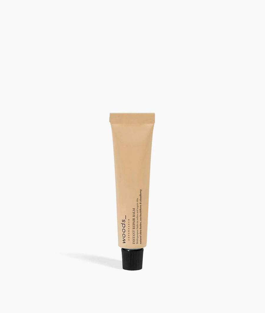 Woods Copenhagen Instant Repair Balm showcased in minimalist product photography, highlighting clean packaging design and natural skincare aesthetic