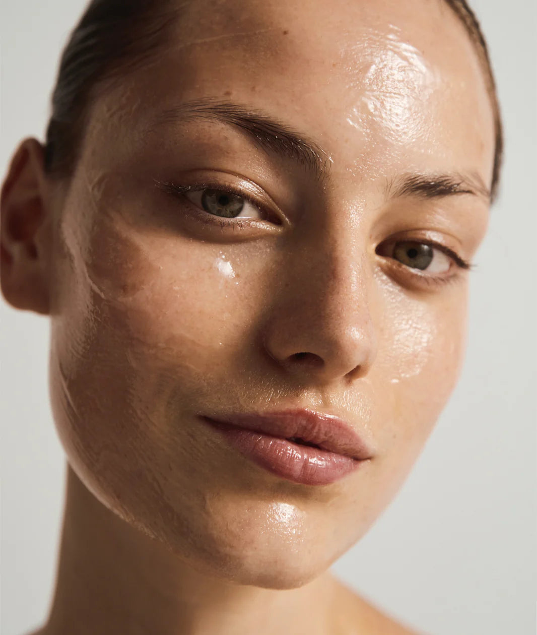 Woods Copenhagen Intense Hyaluronic Mask effect - close-up of glowing, hydrated skin with natural, dewy complexion highlighting mask's intense moisture benefits